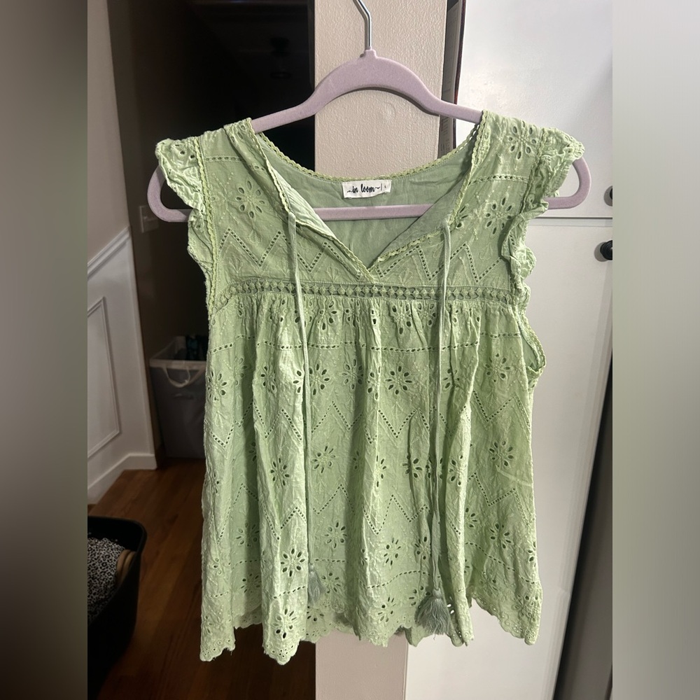 Green blouse. Size L, runs small. Side zipper. Smoke free home.